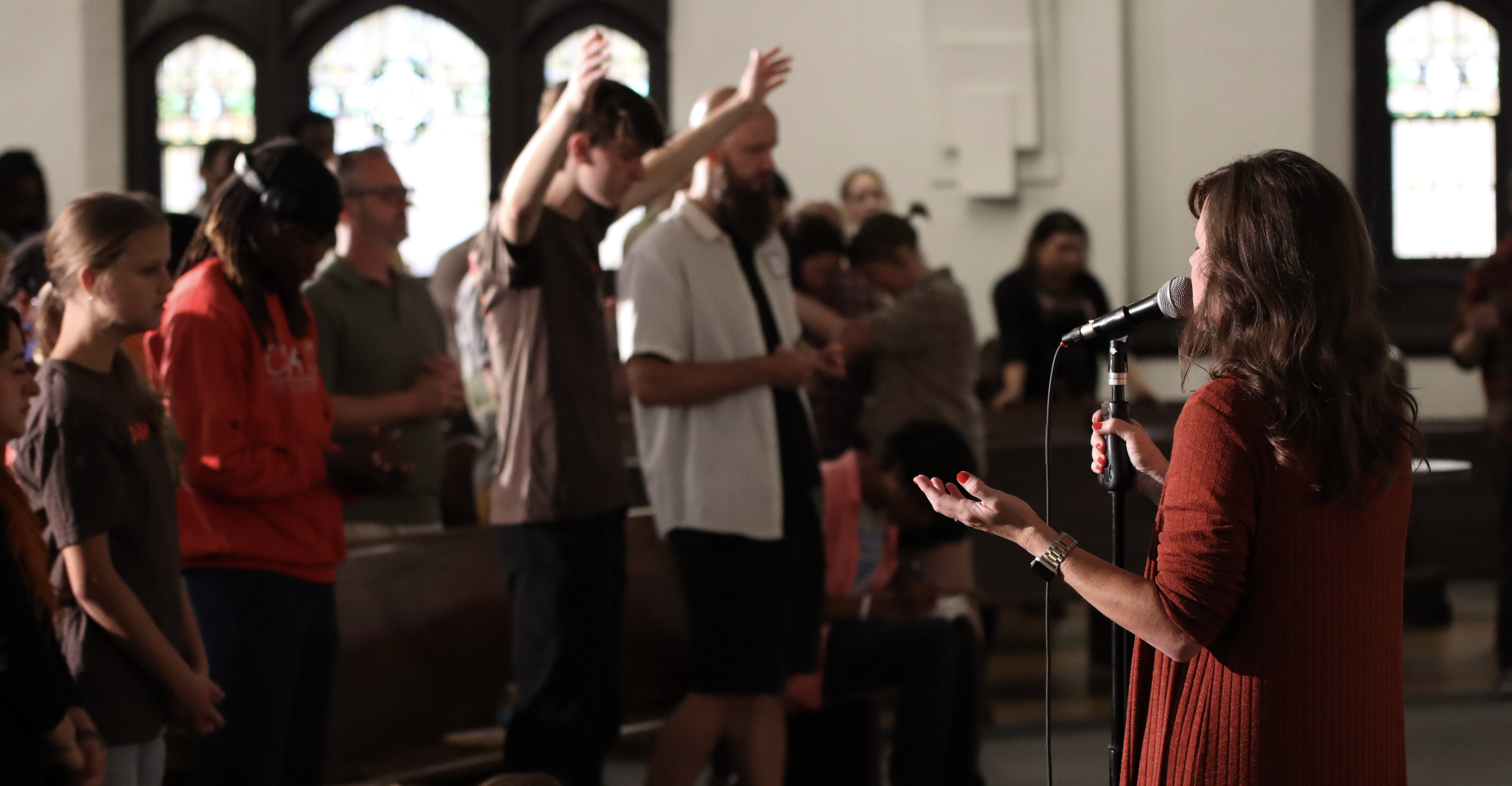 Diverse group of Christians meeting in Trinity Church Chicago, reflecting interdenominational Christian community and unity.